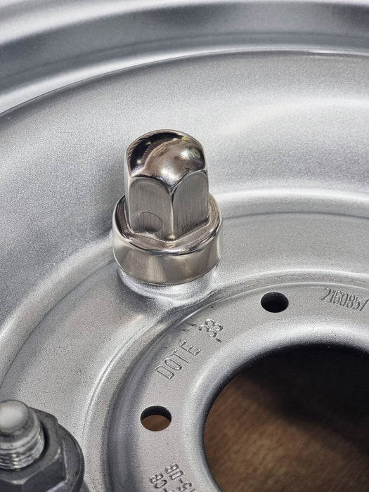 Spare Nut Cap Covers for 16" PAR-180 Transit Trims attached to a wheel nut