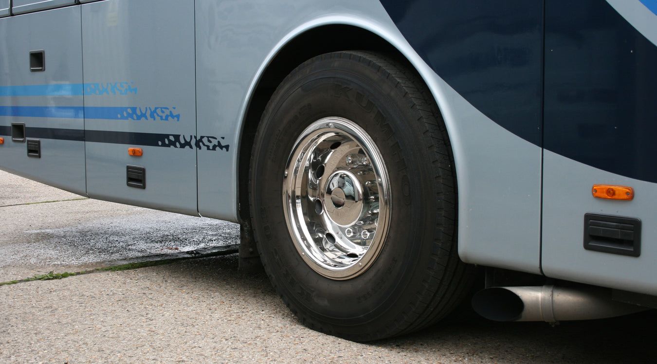 22.5" Super Deluxe Style Trims attached to a bus wheel.