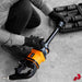 Impulse air impact wrench connected to air hose, in use on a truck wheel