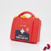 Red first aid kit with 'Blue Dot' branding on a white background