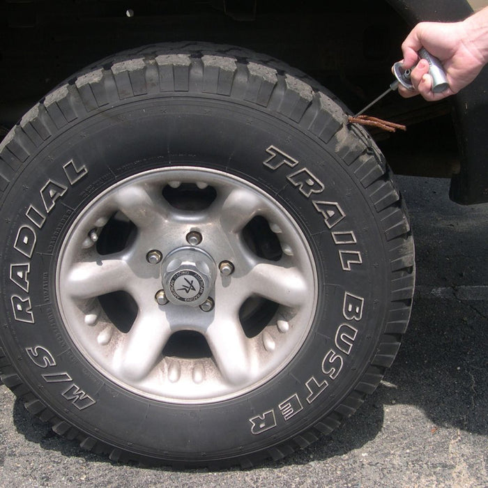 Fitting a Safety Seal repair plug into a trailer tyre using an insertion tool