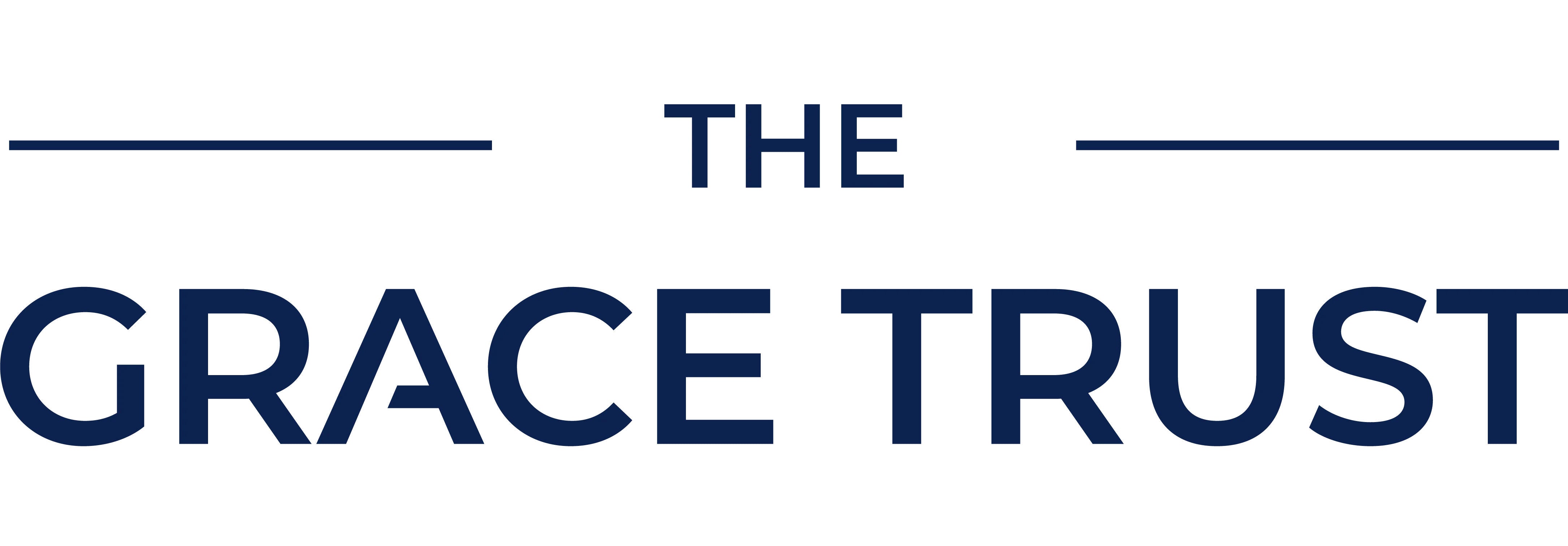 The Grace Trust Logo - Navy blue letters. 'THE' is in small in size but in cpatial letters, with two thin lines either side of it. Below this says 'GRACE TRUST', also in capitals and the same clear font.
