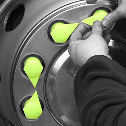 Long reach yellow dustites being attached to an HGV wheel